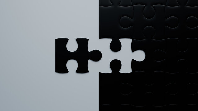 Black and White Jigsaw Puzzle texture Backdrop with final piece moving into place. Completion Concept.