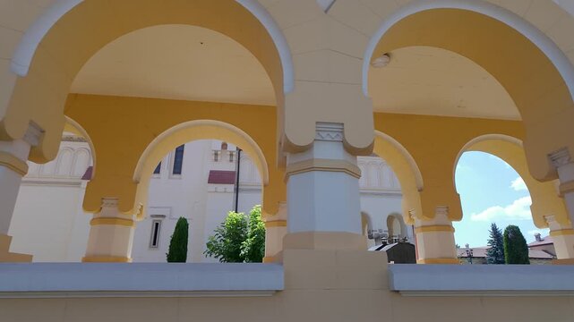 Arcaded gallery with yellow arches inside Alba Carolina Citadel in Alba Iulia Romania