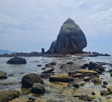 Rocky Coast and Sea Stack at Papuma Beach, Jember, East Java, Indonesia