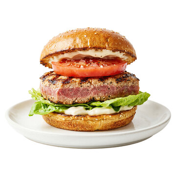 Gourmet Beef Burger with Lettuce and Tomato on Plate Isolated