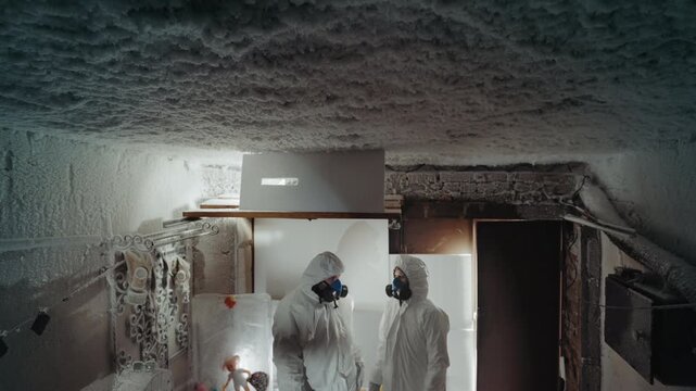 Investigation of house. Contamination inspection conducted using geiger counter and documentation tools. Assessing radiation levels and collecting samples during winter in damaged icy residence