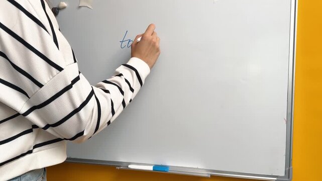 Writing a To Do List Heading on a Whiteboard with a Blue Marker