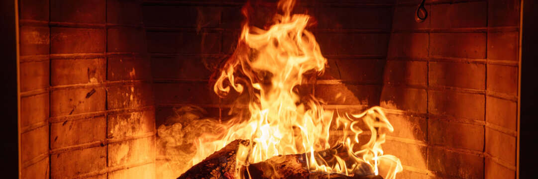 Fireplace burning wood logs. Cozy warm home in winter, Christmas time bonfire. Fire flames