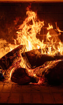 Fireplace burning wood logs. Cozy warm home in winter, Christmas time bonfire. Fire flames