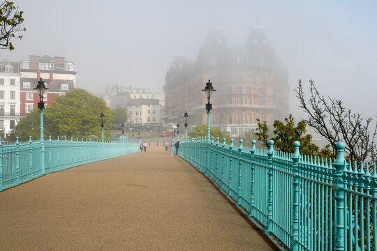 Pedestrian bridge featuring the Grand Hotel Scarborough in the background during heavy fog