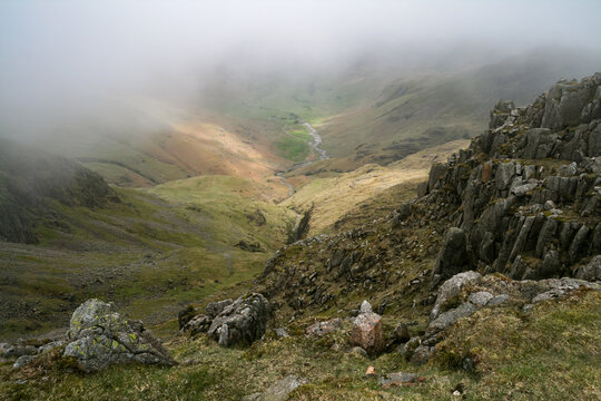 Misty mountain view looking down from Crinkle Crags in the Lake District