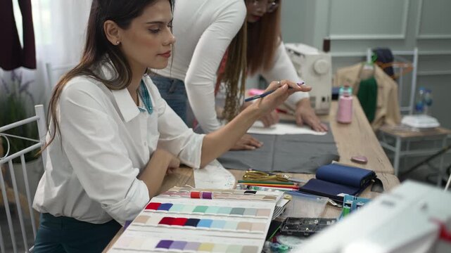 Designers Sketching Garment Pattern in Tailor Workshop