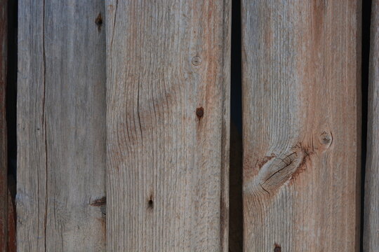 Old objects, artifacts, old wooden grey-orange boards with crumbling, dry paint and rusty nails.