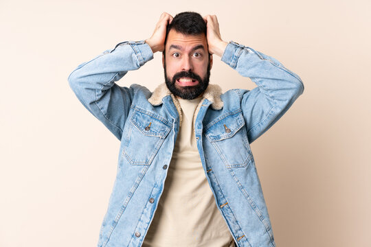 Caucasian man with beard over isolated background doing nervous gesture