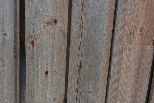 Old objects, artifacts, old wooden grey-orange boards with crumbling, dry paint and rusty nails.