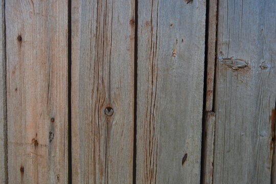 Old objects, artifacts, old wooden grey-orange boards with crumbling, dry paint and rusty nails.