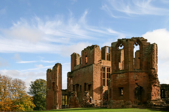 Ruined red sandstone walls of historic Kenilworth Castle in Warwickshire England