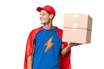 Super Hero delivery man over isolated background laughing in lateral position © luismolinero