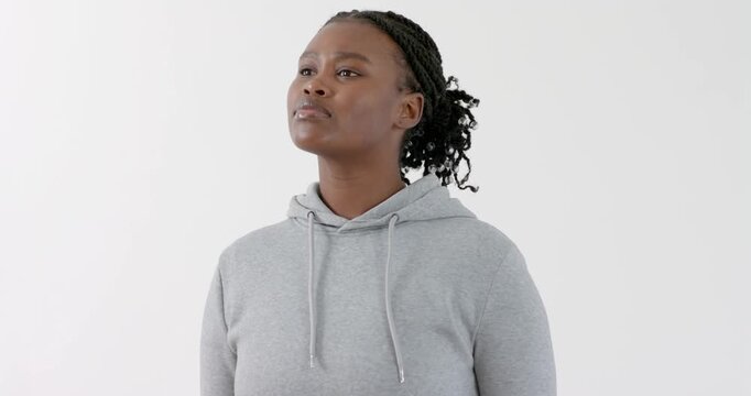 High speed photography for dynamic scenes, Confident woman in gray hoodie looking up, standing again