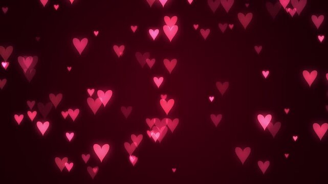 Glowing pink hearts floating on dark background for romantic Valentines Day video loop animation