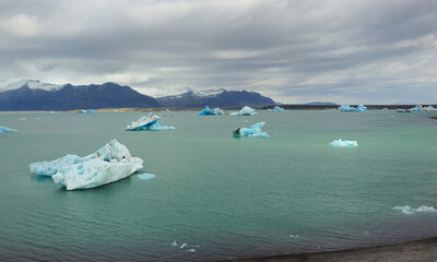 Blue icebergs floating in Jokulsarlon glacier lagoon in Iceland © Michalis Palis