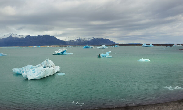 Blue icebergs floating in Jokulsarlon glacier lagoon in Iceland
