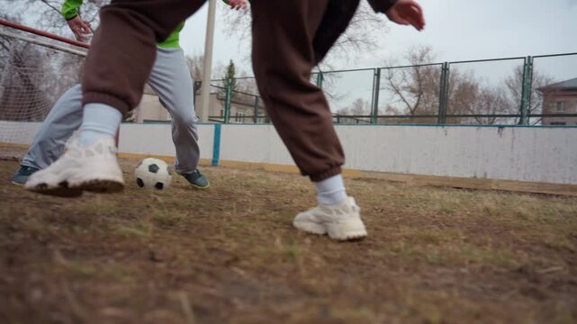 participants contest passionately near goal, contestants and players engage in vigorous battles close to goal, participants demonstrate intense rivalry and determination near goal and net areas