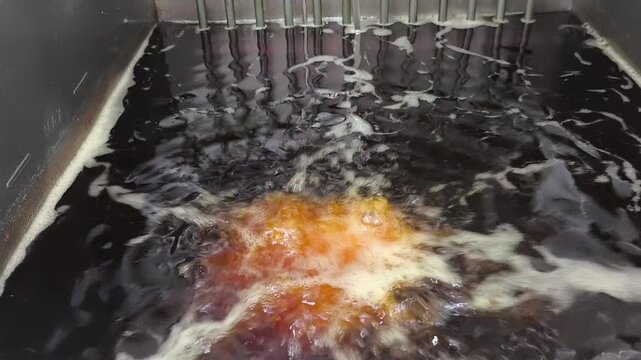 Chicken Being Deep Fried in Hot Cooking Oil