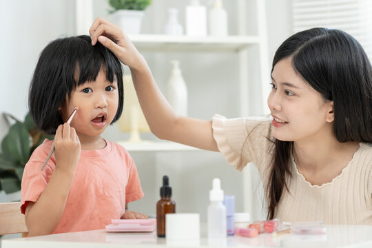 older sister make up and play for Happy sister. Girl applying makeup. Activity family, Advertisement, lifestyle , cosmetics, makeup accessories, beauty activity, beautician, talent