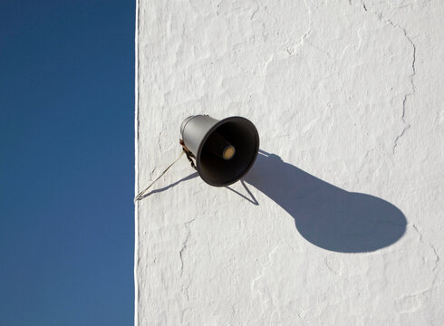 loudspeaker on  a whitewashed wall