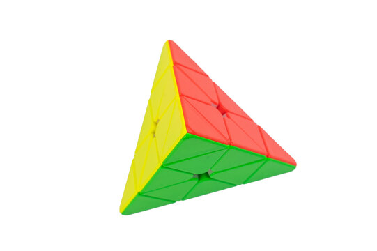 Colorful pyraminx pyramid puzzle isolated on white background, geometric brain teaser toy for logic training, minimal studio composition with bright plastic pieces.