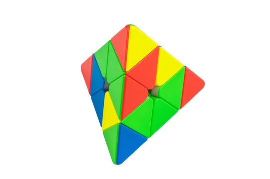 Colorful pyraminx pyramid puzzle isolated on white background, geometric brain teaser toy for logic training, minimal studio composition with bright plastic pieces.