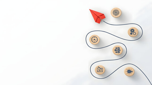 Red paper plane flying on a winding path toward business goals and innovation represented by wooden blocks with icons of gear, clock, team, and lightbulb on a clean white background concept.