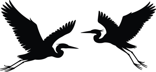 Fototapeta premium Two black silhouettes of flying herons, isolated on a white background, featuring detailed wing feathers and long pointed beaks in a dynamic pose