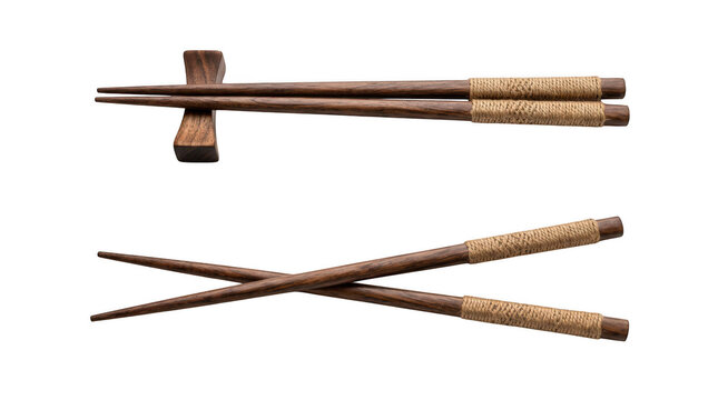 Pair of dark wooden chopsticks with wrapped rope handles on a wooden rest and crossed, isolated on transparent background