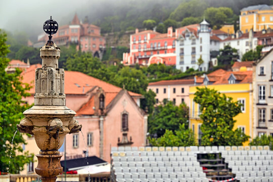 Historic Fountain in Pra&ccedil;a da Rep&uacute;blica Square with Defocused Sintra Cityscape