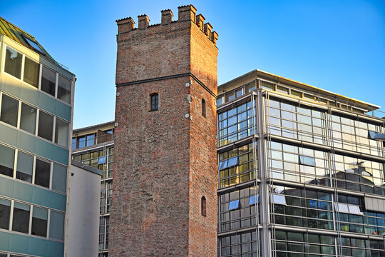 Historic Medieval L&ouml;wenturm Brick Tower Surrounded by Modern Architecture in Munich