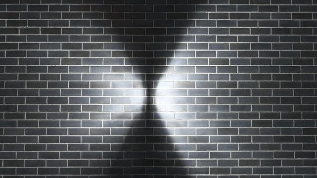 Dark brick wall with dramatic spotlight beams creating hourglass light effect, moody urban grunge background texture