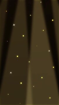 Golden light animation loop with falling particles and shining yellow rays in dark background.