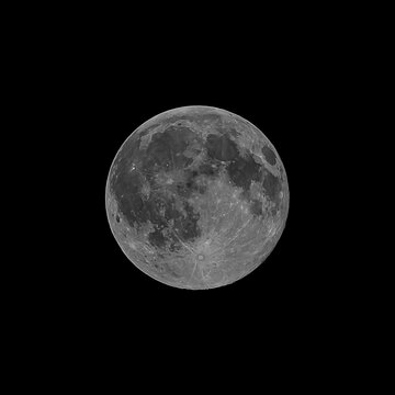 Paris, France - 09 26 2026: Detail view of a full moon by night from the city