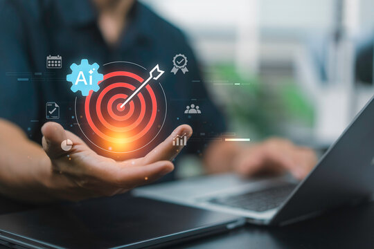 AI Performance Targeting with business professional using laptop, AI gear and bullseye target for strategic goal optimization, KPI focus, decision support and enterprise performance management