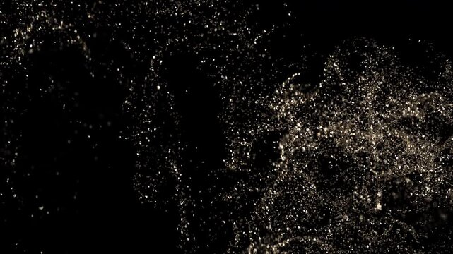 Golden glitter in black background. Video in loop. Abstract glitter effect with gold shimmer for wedding design, awards ceremony, events, celebration day.