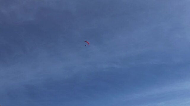 Para glider flying above the Langdales
