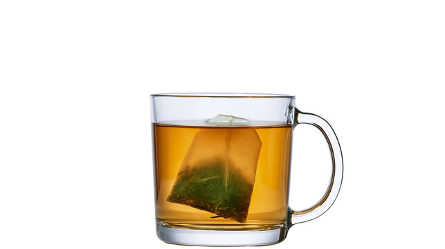 Clear glass mug with amber tea and green tea bag, isolated on transparent background