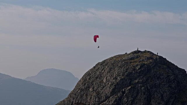 Para glider flying above Pike O'Stickle
