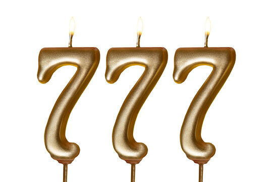 Three golden number seven 777 candles with burning flames isolated on a transparent background, symbolizing birthday celebration, good luck, success, fortune, wishes and joyful special occasions