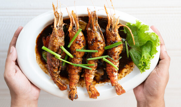 Traditional Thai red shrimp curry with chili, Coconut shrimp curry, Thai yellow curry with seafood, Spicy shrimp curry, authentic prawn masala, gourmet seafood dish on a white background