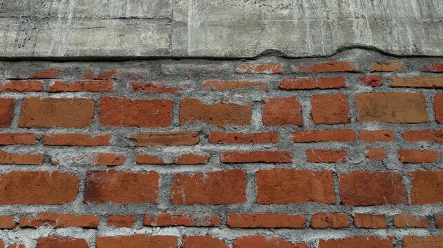 4K horizontal video of vintage red clay brick wall texture and weathered surface pattern