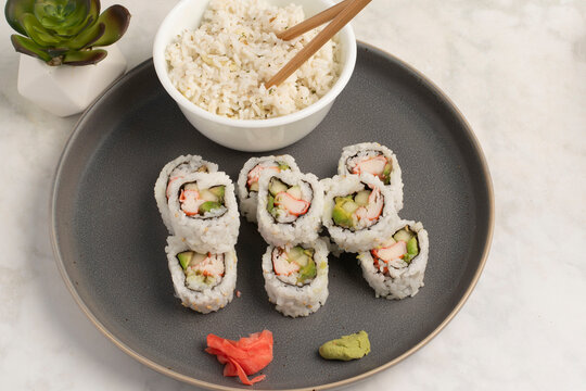 california rolls served with a side pf rice