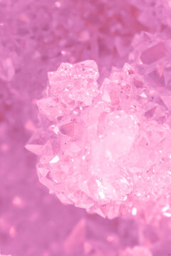 Amethyst pink crystals. Gems. Mineral crystals in the natural environment. Texture of precious and semiprecious stones. Seamless background with copy space colored shiny surface of precious stones.