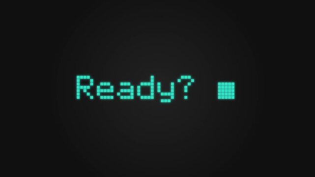 Retro pixelated text reading ready with a blinking cursor on dark screen background.