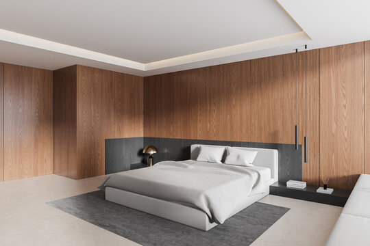 Contemporary minimalist bedroom interior with warm walnut wood paneling, white upholstered bed, ambient lighting, and refined modern architectural details. 3D Rendering