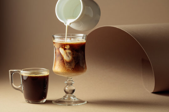 Black coffee and iced coffee cocktails on a beige background.