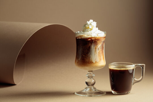 Black coffee and iced coffee cocktails on a beige background.