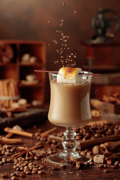 Cream and coffee cocktail with toasted marshmallow and chocolate crumbs.